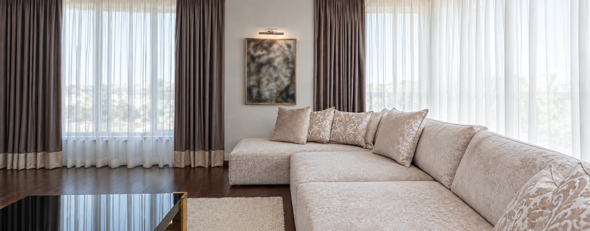 Charcoal curtains and white sheers around a bright living room